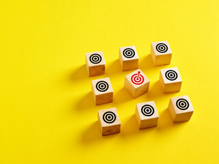 Wall Mural - business goal setting and achieving goals and objectives concept. wooden cubes with target icons.