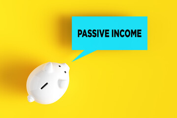 Wall Mural - Piggy bank with the word passive income on a speech bubble. Business and passive income concept.