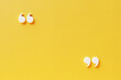 Quotation mark with copy space on yellow background, White quotation mark on yellow wall 3d illustration.