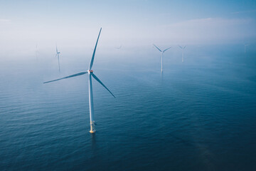 wind turbine. aerial view of wind turbines or windmills farm field in blue sea in finland.