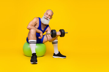 Sticker - Full size portrait of sporty grandfather sit fit ball lifting dumbbell isolated on yellow color background