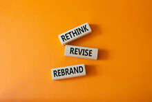 Rethink Revise Rebrand Symbol. Wooden Blocks With Words Rethink Revise Rebrand. Beautiful Orange Background. Business And Rethink Revise Rebrand Concept. Copy Space.