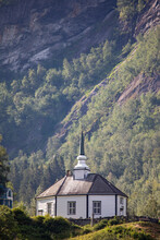 A Church With Steeple Beside A Mountainside In Geiranger, Norway; Geiranger, Standa, Norway