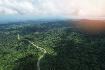 Wall Mural - curvy asphalt road in mountain background