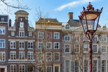 Traditional Residential Buildings Along The Canal In Amsterdam; Amsterdam, North Holland, Netherlands