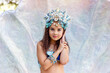 © Natasha  - A beautiful little girl in a crown and mermaid costume in a large seashell