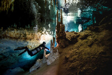 A Cave Diver Following A Line That Passes Below An Air Bell Deep In The Underground System.