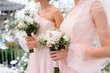 Close Up Of Girls Holding Wedding Bouqets On Wedding Ceremony
