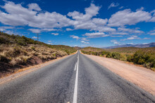 Straight Paved Two-lane Road Leading Into The Distance, Route 62 In South Africa; South Africa