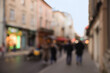 © New Africa - Blurred view of people walking on city street