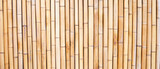 Fototapeta Fototapety do sypialni na Twoją ścianę - Yellow bamboo texture. Dried bamboo wall or fence background