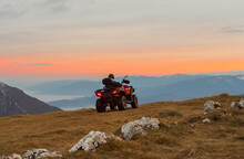 A Rider Riding Quad Bike Atv Off Road On The Mountain At Sunset Adventure Travel.