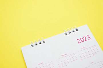 Wall Mural - white calendar 2023 on yellow background