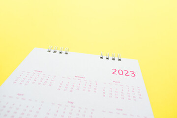 Wall Mural - white calendar 2023 on yellow background