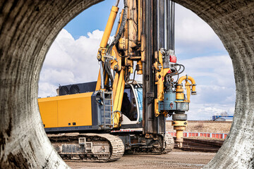 Powerful hydraulic drilling rig at a construction site. The device of pile foundations. Bored piles. Heavy construction equipment.