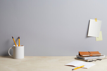 modern desk with various office supplies, front view and copy space.