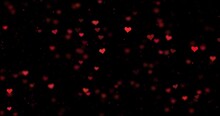  Seamless Looping Blurred Red Hearts And Glitter Motion On Clean Black Background