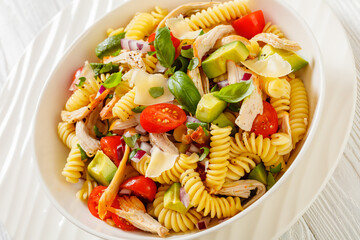 Wall Mural - Chicken Pasta Salad with Avocado, Tomato in bowl