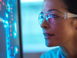 © Connect Images - Scientist in glasses looking at screen