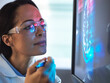 © Connect Images - Scientist in glasses looking at screen with medical brain data