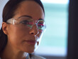© Connect Images - Scientist in glasses looking at screen with medical data