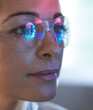 © Connect Images - Scientist in glasses looking at screen