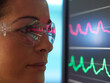 © Connect Images - Scientist in glasses looking at screen with medical data