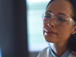 © Connect Images - Scientist in glasses looking at screen with medical data