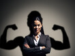 © IBEX.Media - Leader with strong personality concept, with business woman having her shadow flex muscles, Generative AI Illustration