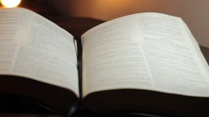 Wall Mural - Bible open on a pulpit with front lighting