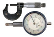 A micrometer for making precision measurements and a dial gauge for shaft runout measurements on an isolated background.