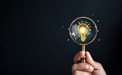 Fototapete - Magnifying glass focus to light bulb icon which for mind, creative, idea, innovation, motivation planning development leadership and customer target group concept...