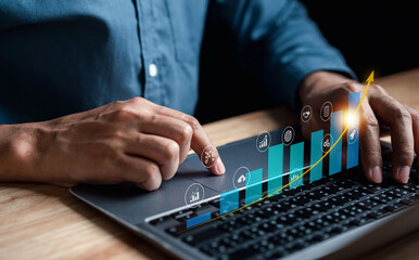 Poster - target on business investing concept, Businessman analyzing company financial balance sheet working with digital graphics. Businessman calculates financial data for long-term investment.