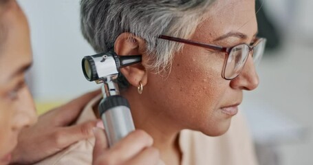 Wall Mural - Nurse, ear or doctor consulting senior woman in an appointment checkup, hearing exam or testing audio results. Wellness, old woman or healthcare worker helping or checking tinnitus on elderly patient