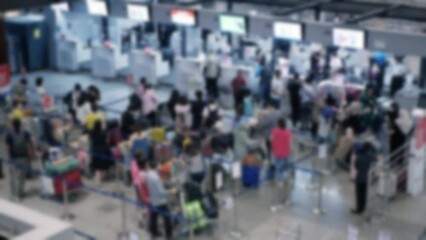 Canvas Print - out of focusing blurred of crowded people passenger lines in airport waiting and check at check in counter area, open country, crowd in International Airport