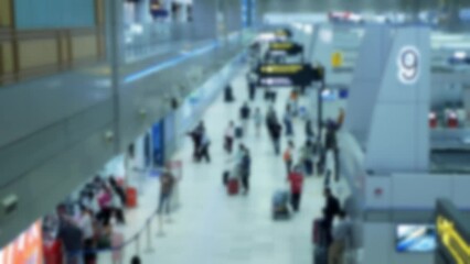 Canvas Print - out of focusing blurred of crowded many passenger people walking in departure arrival hall of international airport while thailand open country