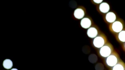 Wall Mural - Abstract Light Dot Background. White and Yellow glowing Light Stripes Moving Diagonally On Dark Background. Dotted lines moving with depth of field effect. Loop 4K footage. 