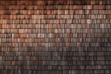 A House Wall Covered With Small Wooden Tiles As A Background 