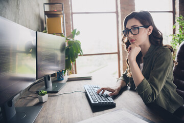 Wall Mural - photo of clever busy lady specialist wear glasses debugging tasks modern gadget indoors workstation 