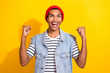 Photo of overjoyed funky man wear trendy clothes scream hooray yeah shopping sale isolated on yellow color background
