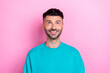 © deagreez - Photo of young cheerful smile positive man wear blue sweatshirt bristle beard look up interested useful information isolated on pink color background