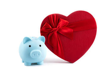 Blue piggy bank and gift box in the form of a heart on a white background