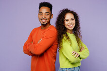 Side View Young Couple Two Friends Family Man Woman Of African American Ethnicity Wear Casual Clothes Together Stand Back To Back Hold Hands Crossed Folded Isolated On Pastel Plain Purple Background.