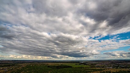 Wall Mural - Beautiful Endless Clouds in the Daylight Skies Seamless. Looped 3d Animation Flying Above the Cumulus Clouds with 4k 4096 2304