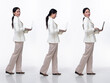 © Jade - Full length 20s Asian Woman wear formal business blazer suit  dress pant shoes. Black long straight hair female hold laptop work confident, walk forward turn left right, white background isolated