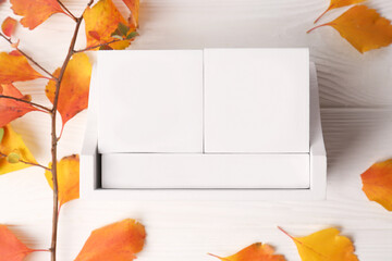 Sticker - Thanksgiving day, holiday celebrated every fourth Thursday in November. Block calendar and branch with orange leaves on white wooden table, flat lay