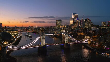 Wall Mural - Establishing shot over London River Thames and Tower Bridge in the evening - aerial view - travel photography