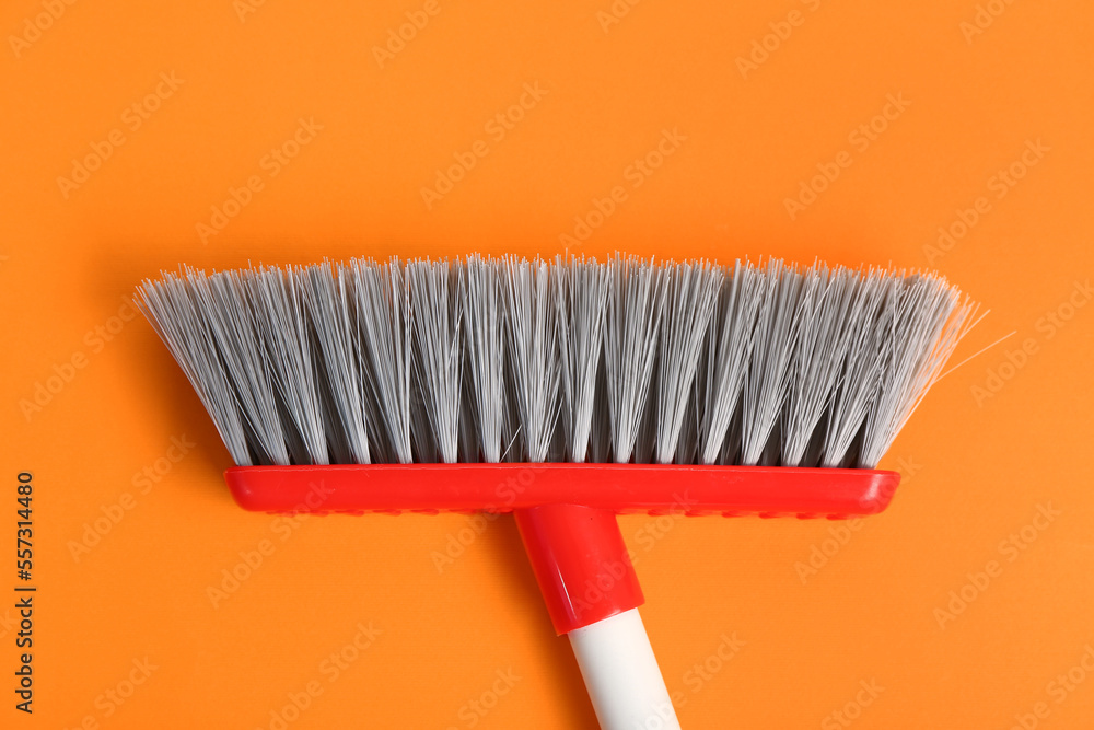 Broom for cleaning on color background, closeup