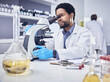 Microscope, scientist and black man with research, healthcare and diagnosis in laboratory. Science, African American male and lab equipment for cure, check sample for illness, virus and innovation.