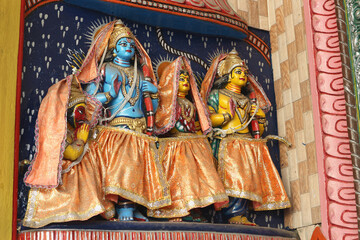 Wall Mural - Sita, Rama and Lakshman - the divine family on the wall of the temple in Puri, Orissa, India.